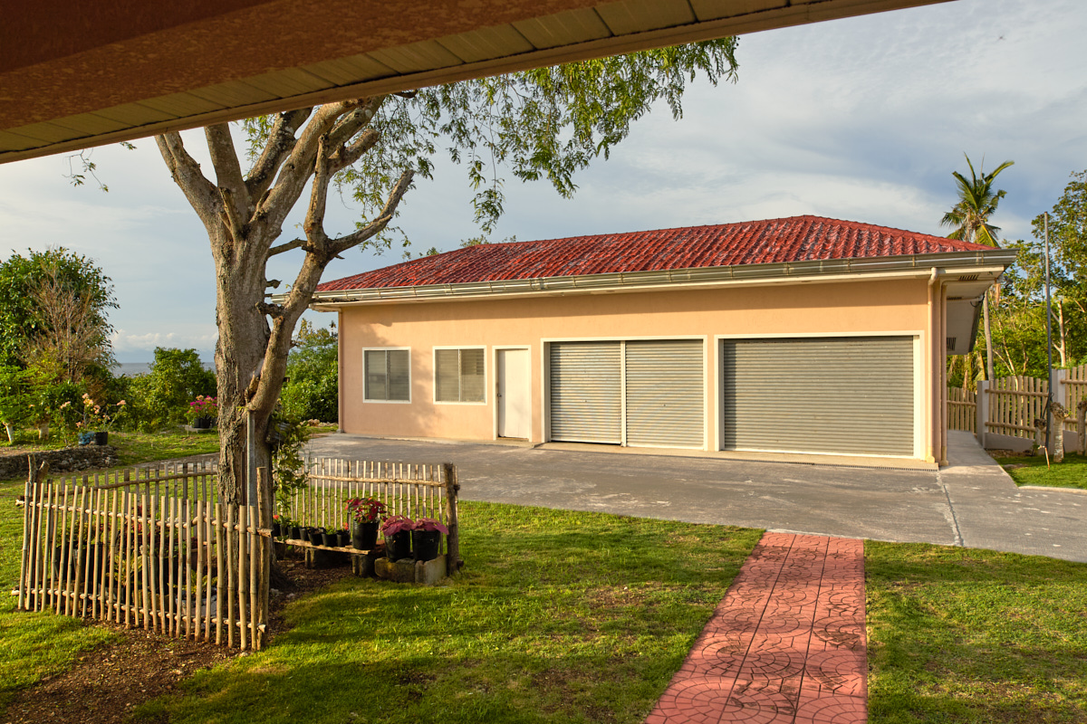 Caretaker's house with two car garages
