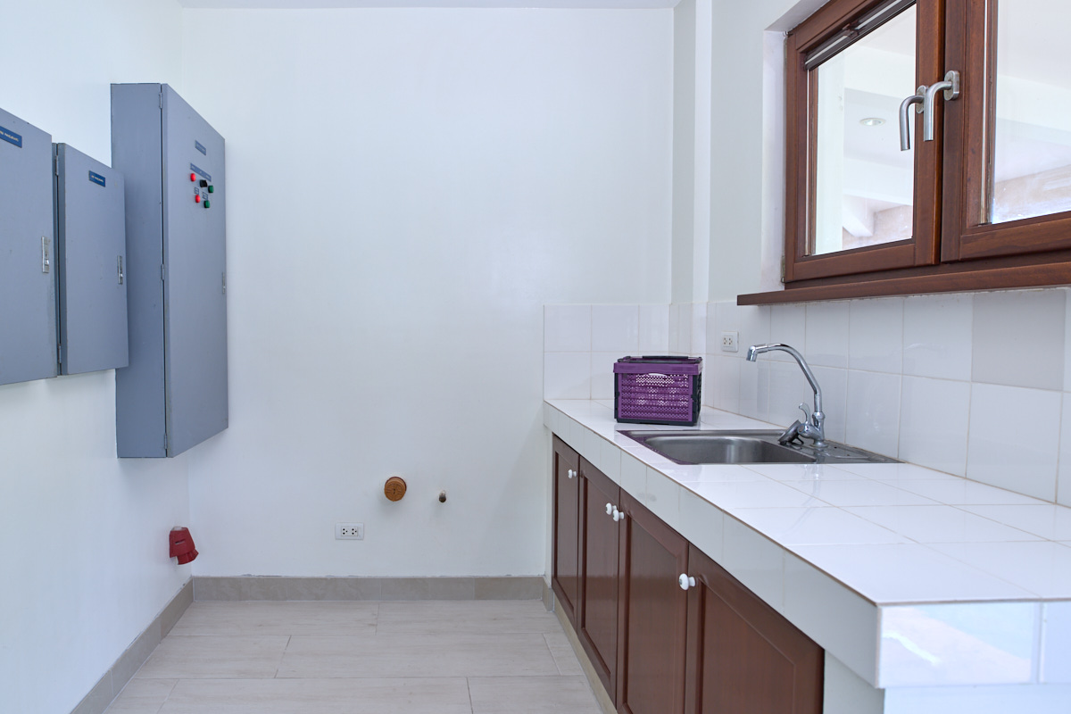 Dirty kitchen with sink and connections