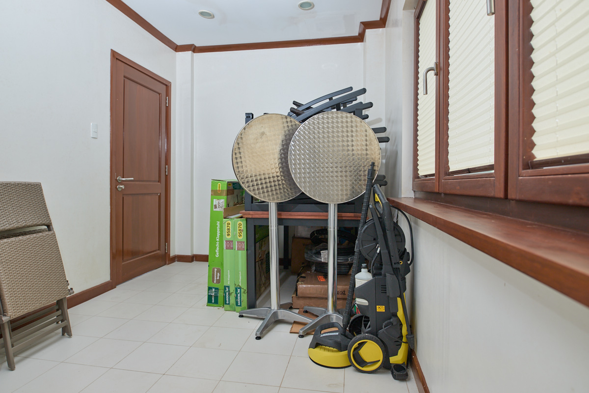 Multi-purpose room with outdoor furniture in storage